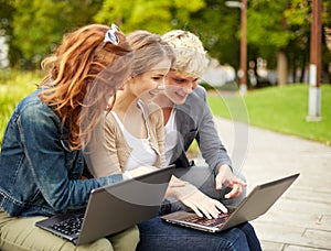 Students or teenagers with laptop computers