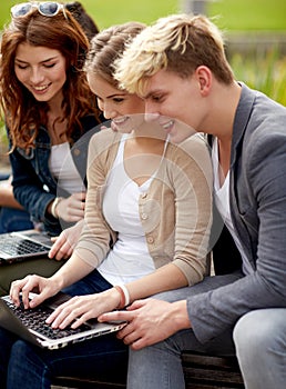 Students or teenagers with laptop computers