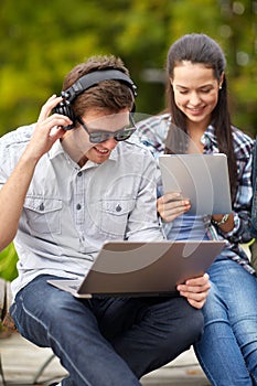 Students or teenagers with laptop computers