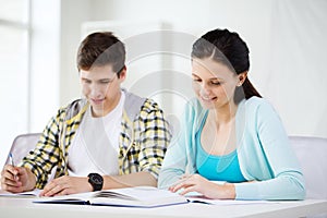 Students with textbooks and books at school