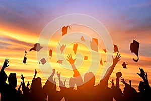 students throwing graduation caps in the Air