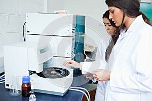Students using a centrifuge photo