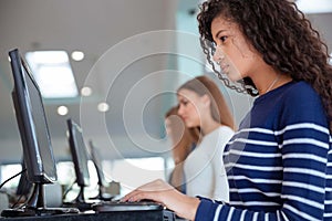 Students using computers in university photo