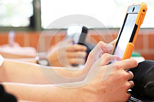 Students using digital technology in the classroom.