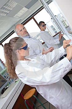 students using microscope in lab