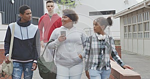 Students walking in their high school grounds