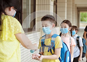 Students washing hand with Alcohol Sanitizer  at school