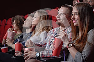 Students watching movie in modern cinema hall