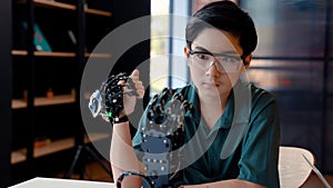 Students wearing wireless controllers move their robotic hands. move your hand test control system Learn about