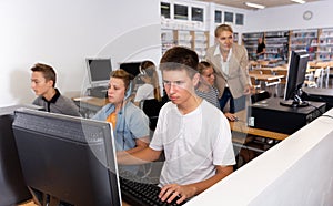 Students working with computers in classroom