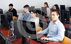 Students working on computers in classroom