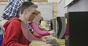 Students working on computers in high school class