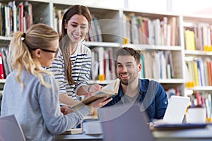 Students working in the library at campus photo