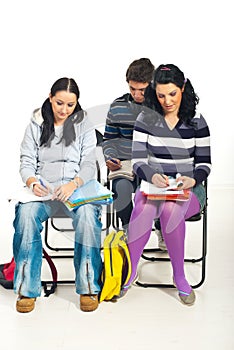 Students writing at course