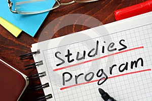 Studies Program written in a notepad. photo