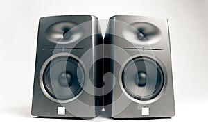 Studio audio monitors on white