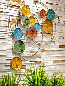 A studio background featuring colorful geometric shapes, with abstract forms, vibrant hues, sunlight and shadows