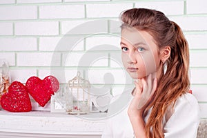 Studio beauty portrait of girl with big eyes and long hair