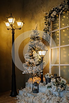 studio with christmass decorations and vintage streetlamps