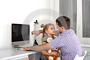 Studio emotional shot of a young girl asking a busy person computer dad give her attention and play with her