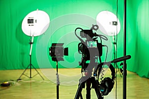 Studio for filming on a green background. The chroma key. Lighting equipment in the Studio. Green screen