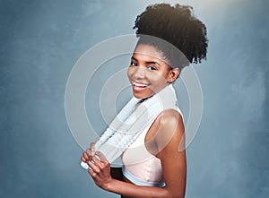 Studio, fitness and portrait of woman with towel for training hygiene, sports and healthy body. Athlete, cloth and face