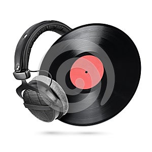 Studio headphones and vinyl record isolated on white