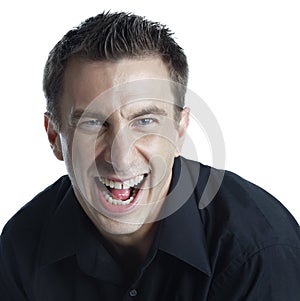 Studio headshot of a happy young man yelling