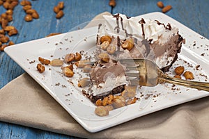 Cutting an ice cream pie with a fork.