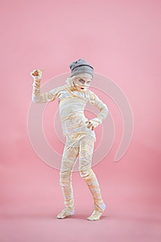 Studio image of a young teen girl man bandaged,