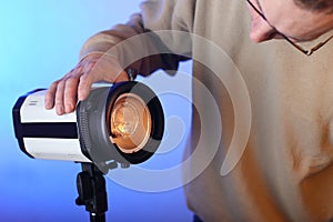 Studio lamp without modifier with a bare burner with a person photo