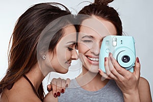 Studio lifestyle portrait of two best friends hipster crazy girls