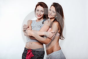 Studio lifestyle portrait of two best friends hipster crazy girls