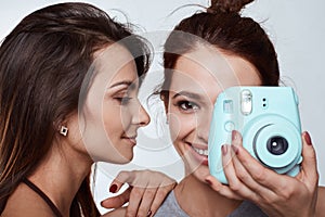 Studio lifestyle portrait of two best friends hipster crazy girls