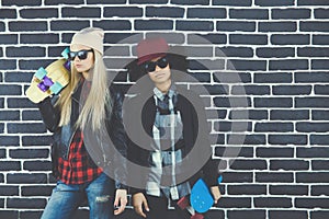 Studio lifestyle portrait of two best friends hipster girls going crazy and having great time together. Isolated on