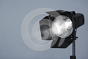 Studio lighting against gray background.