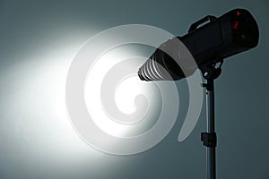 Studio lighting against gray background.