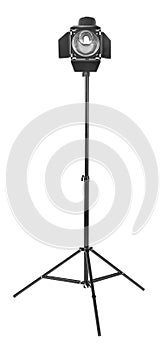 Studio lighting on a tripod stand, isolated on a white background. Searchlight for cinema.