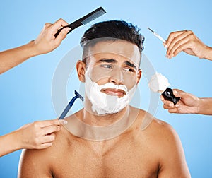 Studio makeover, unhappy man and beauty by hands of professional stylist team grooming on a blue background mockup