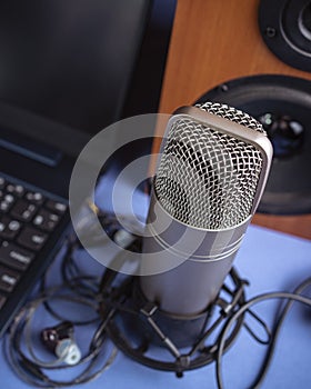 Studio microphone, headphones, speakers and computer. Home studio recording for sound mixing, sound design and music