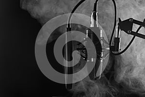 Studio Microphone isolated on a white background. Smoke banner