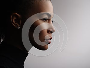 Studio photo of an african american female model face, profile