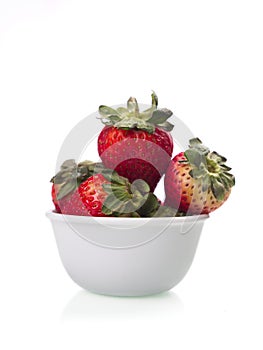 Studio photo of a bowl of strawberries