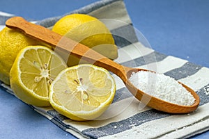 Studio photo of citric acid and lemons