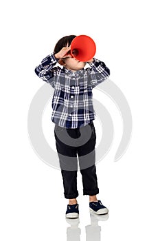 A studio portrait of an asian male child playing with a megaphone