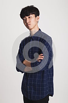 Studio portrait of an Asian young man with disappointment at something