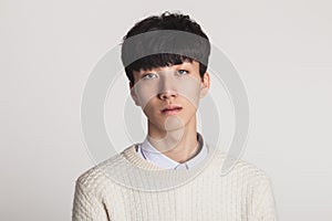 Studio portrait of Asian youth with no motivation