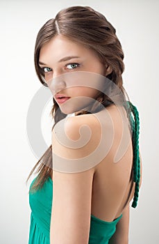 Studio portrait of attractive girl in green outfit