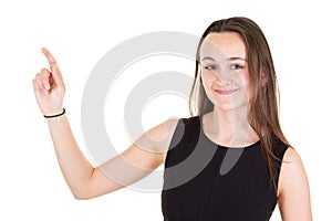 Studio portrait of attractive young woman pointing side copyspace with finger