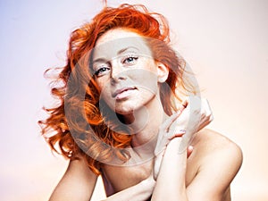 Studio portrait of a beautiful redhead woman